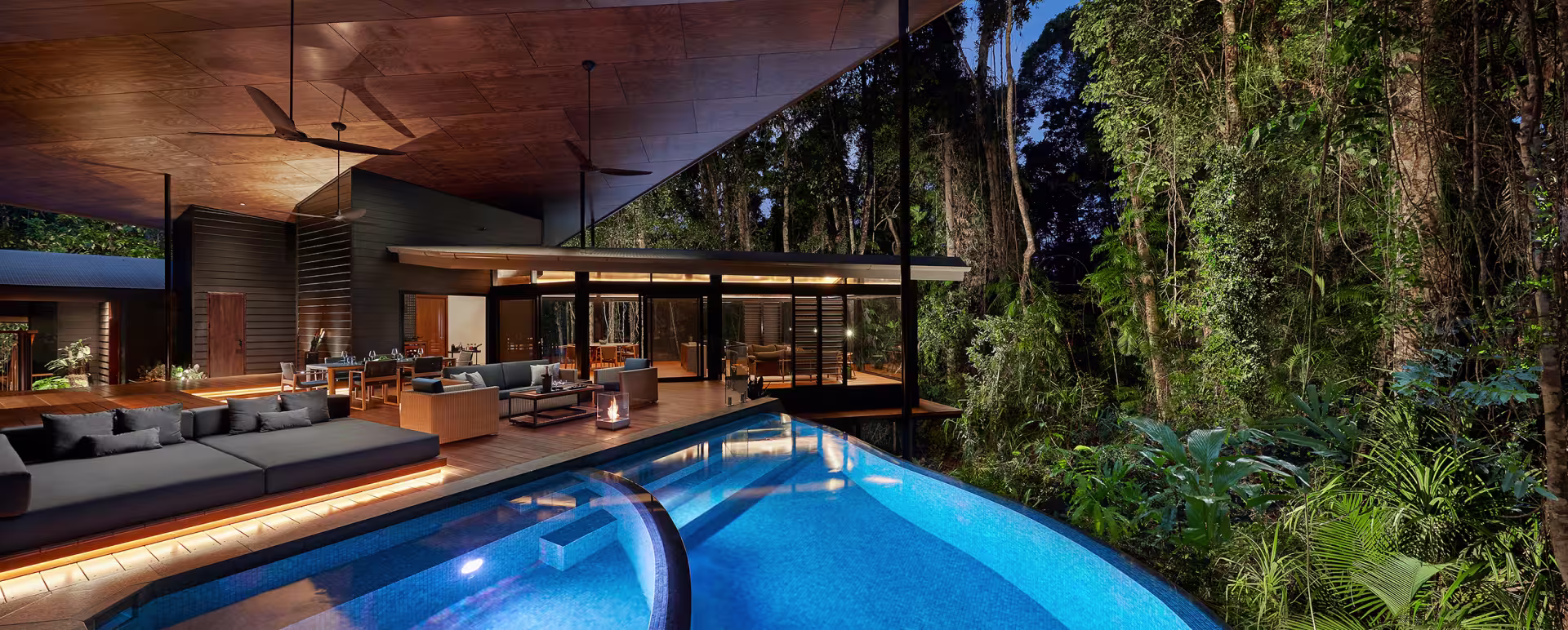Timber pavilions above the Mossman River at the edge of the Daintree