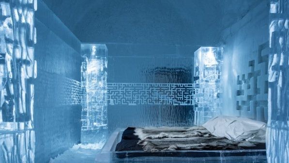Sprayed snow vaults and carved ice detail across the winter buildings on the ice wire